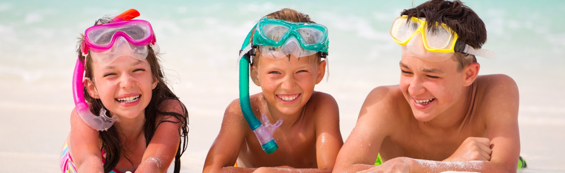 Kids laughing on the beach